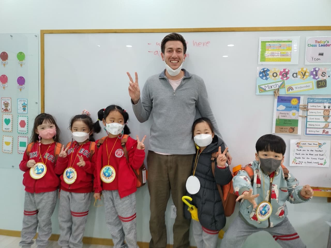 Matt smiling with his small group of South Korean students