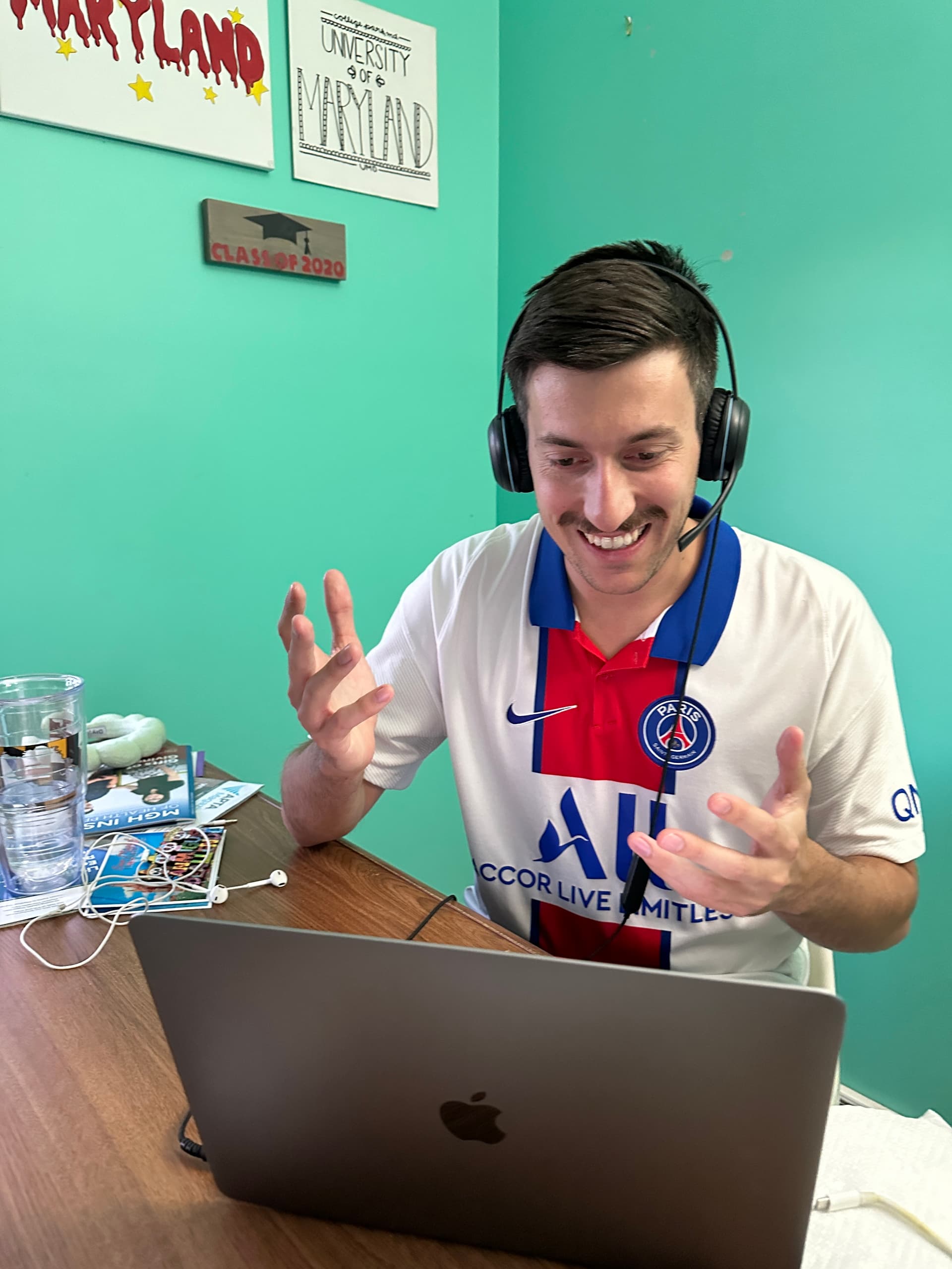 Matt working from a laptop in a cozy cafe