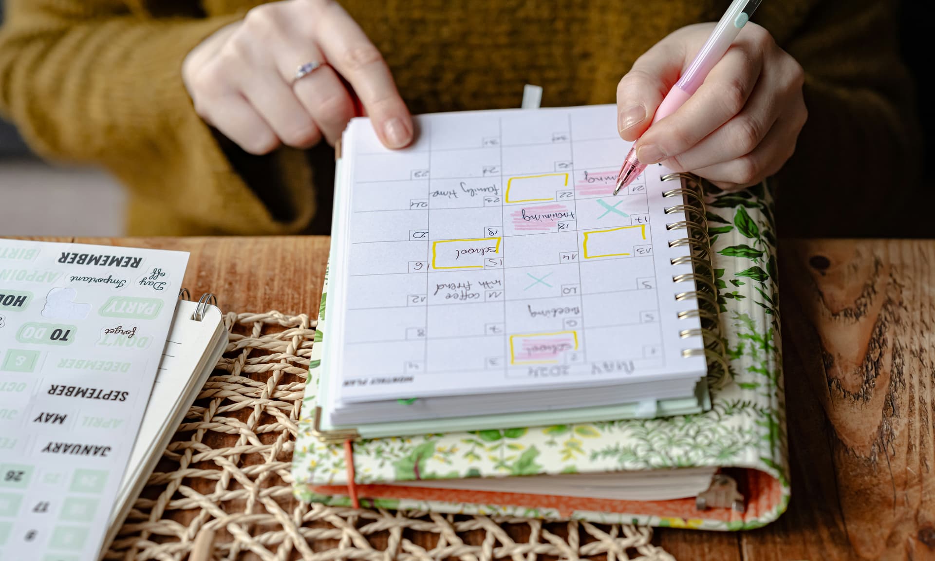 Teacher using a planner to organize schedule