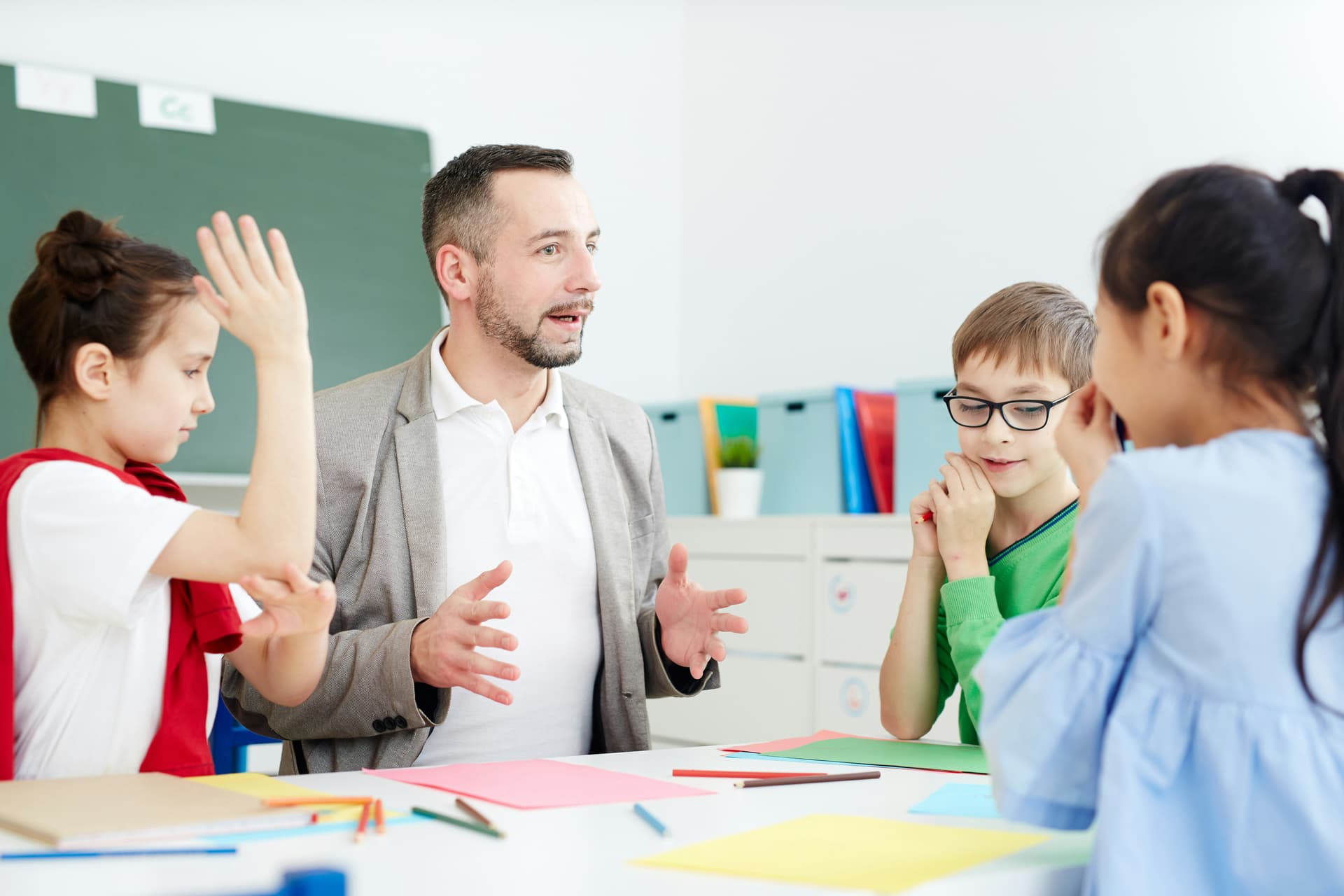 Teacher engaging with students of different ages